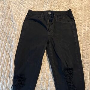 Black Distressed Jeans
Ripped knees raw hem
25 inch inseam